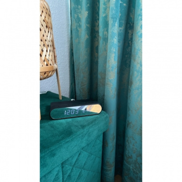 Logotrade meened pilt: Äratuskell ja juhtmevaba laadija ADELAIDE